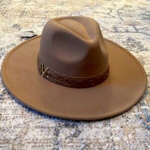 Camel wide-brim fedora hat with floral strap.